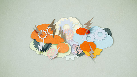 Textured, paper cutting style background with cutouts of clouds, thunderbolts, and gears in various colors of orange, green, cream, gold, and blue paper all layered on top of each other. 
